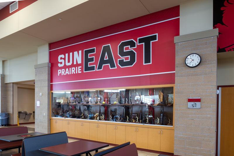 Sun Prairie East's branding and trophy wall.